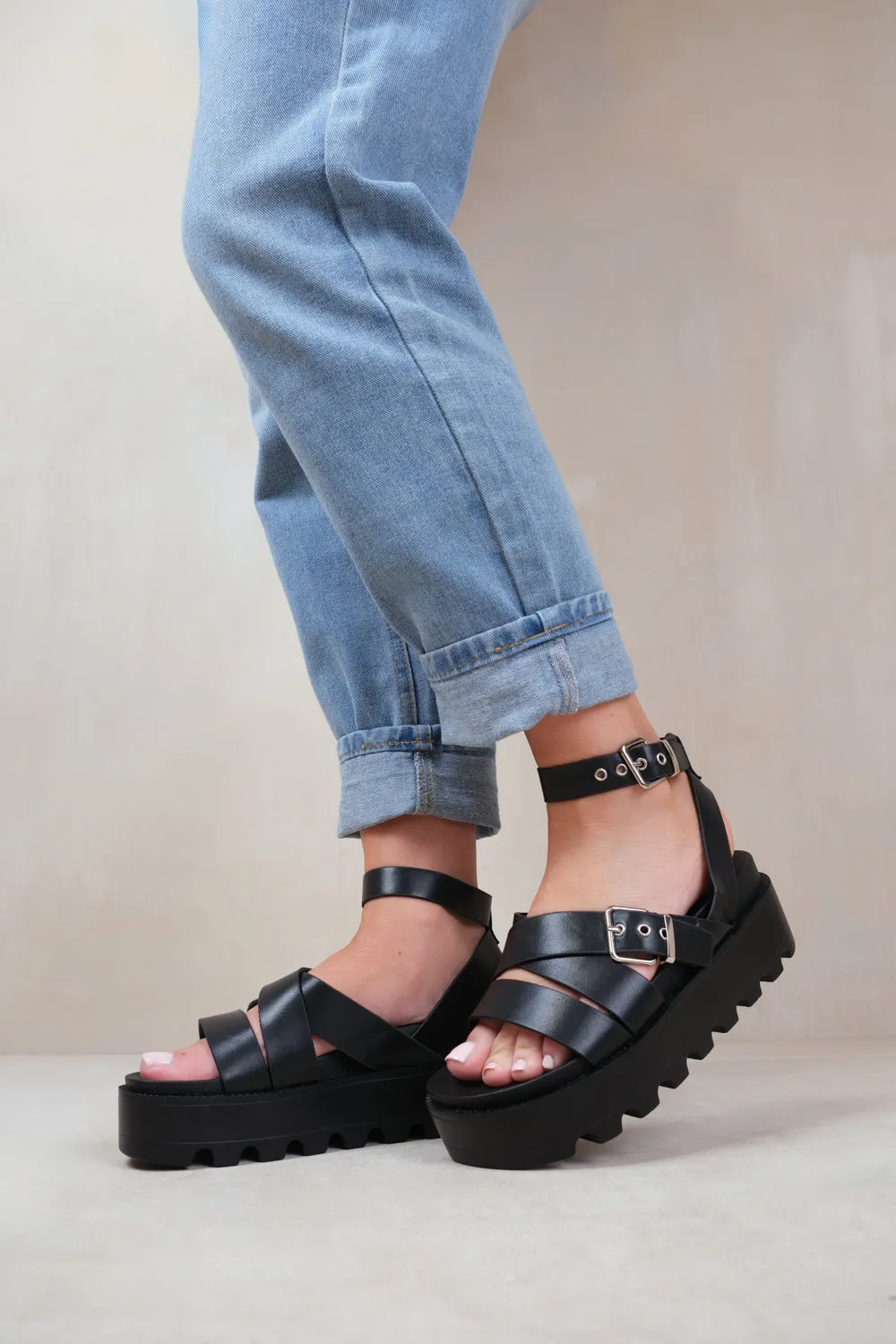 LAYLA BUCKLE STRAP PLATFORM SANDALS IN BLACK FAUX LEATHER