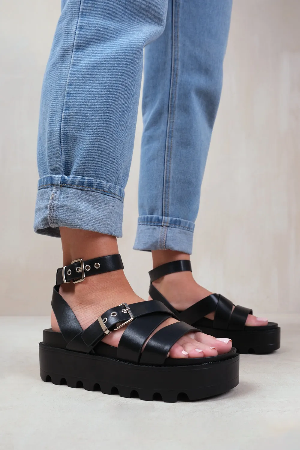 LAYLA BUCKLE STRAP PLATFORM SANDALS IN BLACK FAUX LEATHER